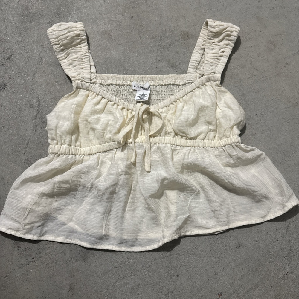 Cream Sleeveless Peplum Top